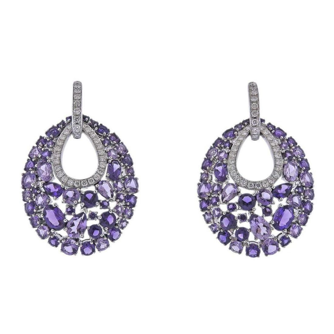 Bucherer Gold Diamond Amethyst Earrings: Brand new with tag Bucherer earrings in 18k gold, set with 0.73ctw VS/H diamond and 8.97ctw in amethyst. Retail $7100. Earrings are 42mm x 25mm. Weight - 17.3 grams. Marked: CB 750.