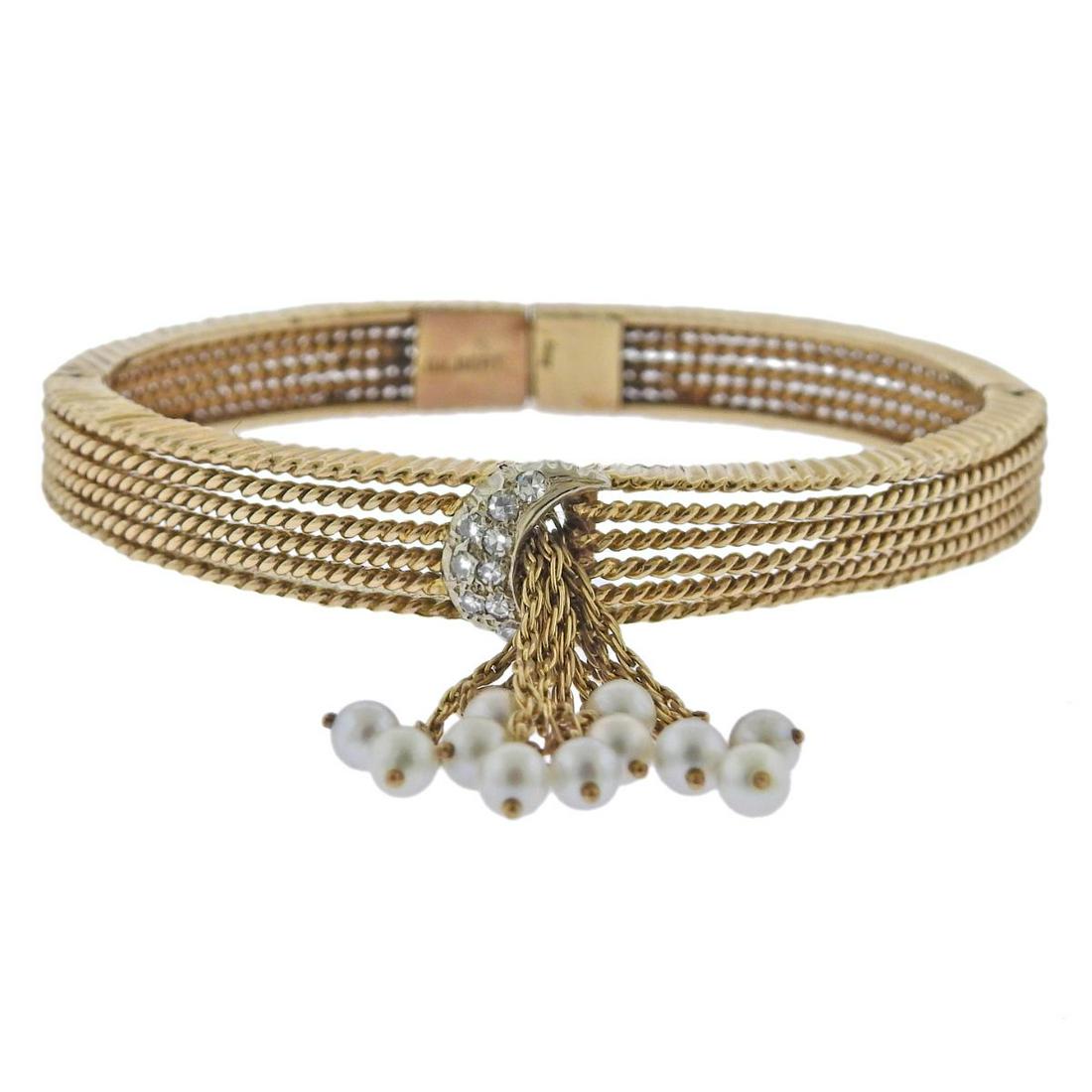 1960s Gilbert 14k Gold Pearl Diamond Tassel Bracelet: 1960s vintage 14k gold bangle bracelet by Gilbert, with pearl tassel front design, and approx. 0.20ctw in diamonds. Bracelet will fit approx. 6.5-6.75" wrist, tassel drop is approx. 36mm long. Marked: