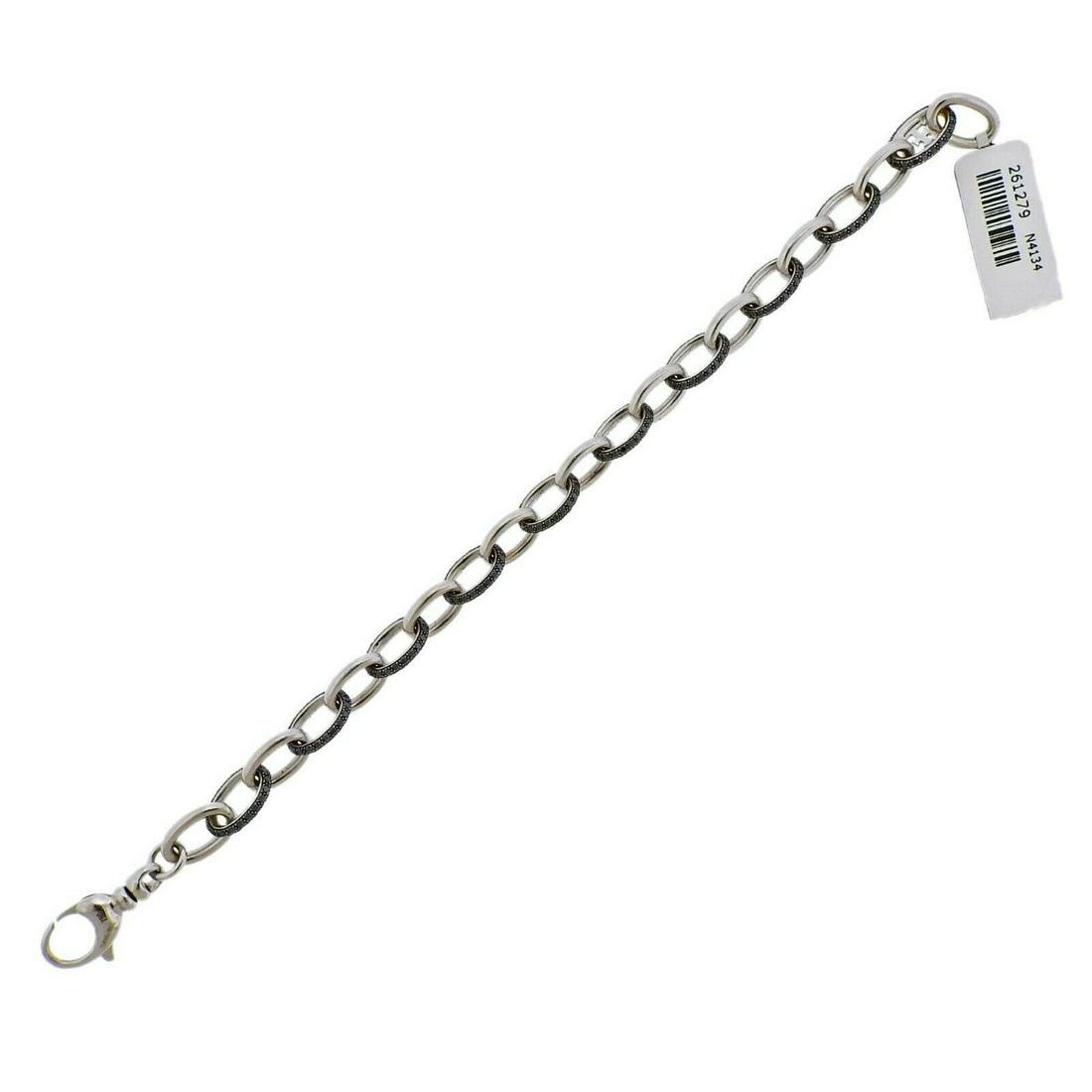 Theo Fennell Gold 3.25ctw Black Diamond Bracelet: 18k gold link bracelet by Theo Fenner, new/old stock, with tag. Retail $6890. Set with approx. 3.25ctw on black diamonds. Bracelet is 7.5" long and 7.5mm wide. Marked TF, English marks, 750. Weight - 