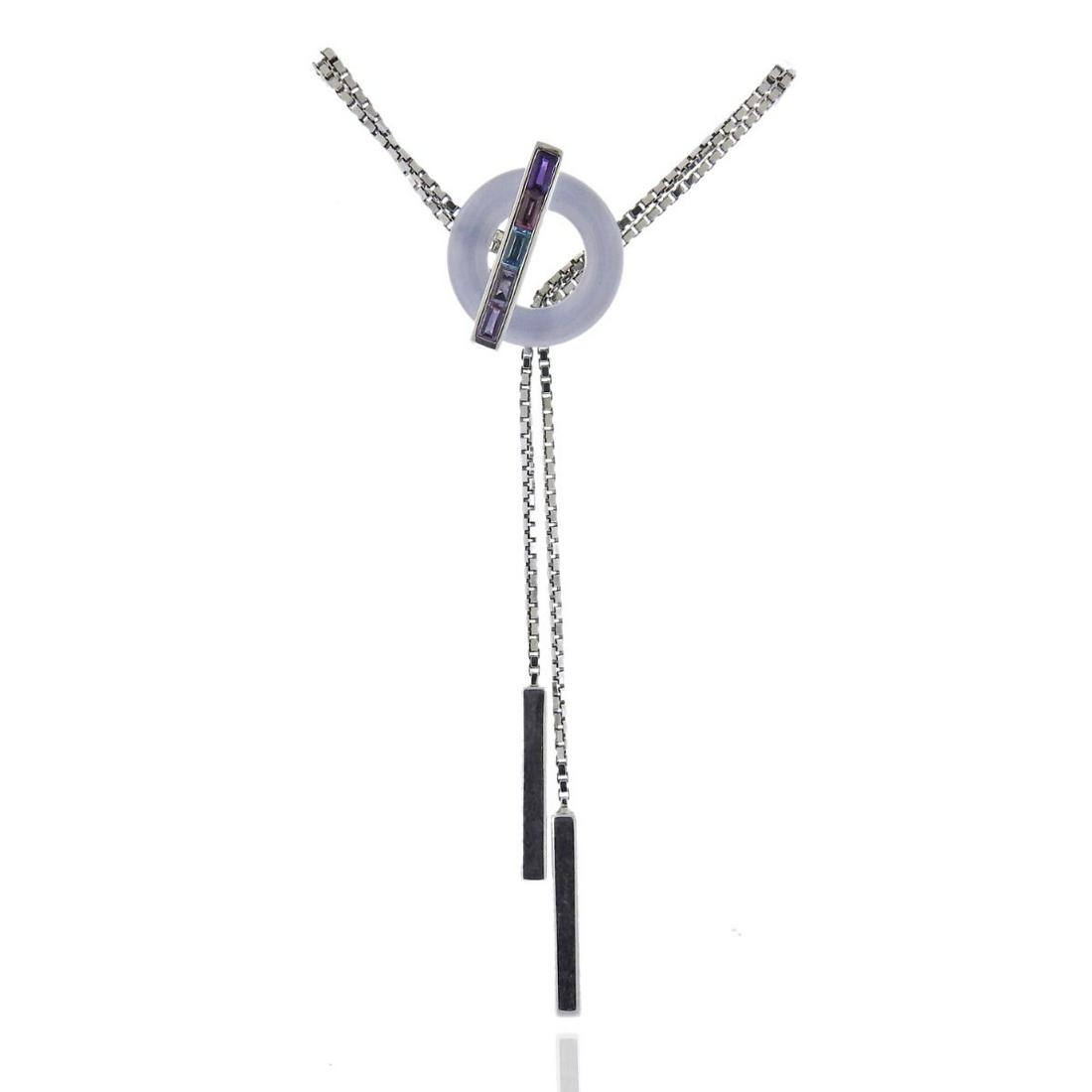 Guy Laroche 18k Gold Gemstone Lariat Necklace: Metal : 18k Gold Designer : Guy Laroche Gemstone : Chalcedony, Amethyst, Topaz, Tourmaline Measurements : Necklace is 16" long, pendant drop is 70mm long Marked: : 18k, Guy Laroche