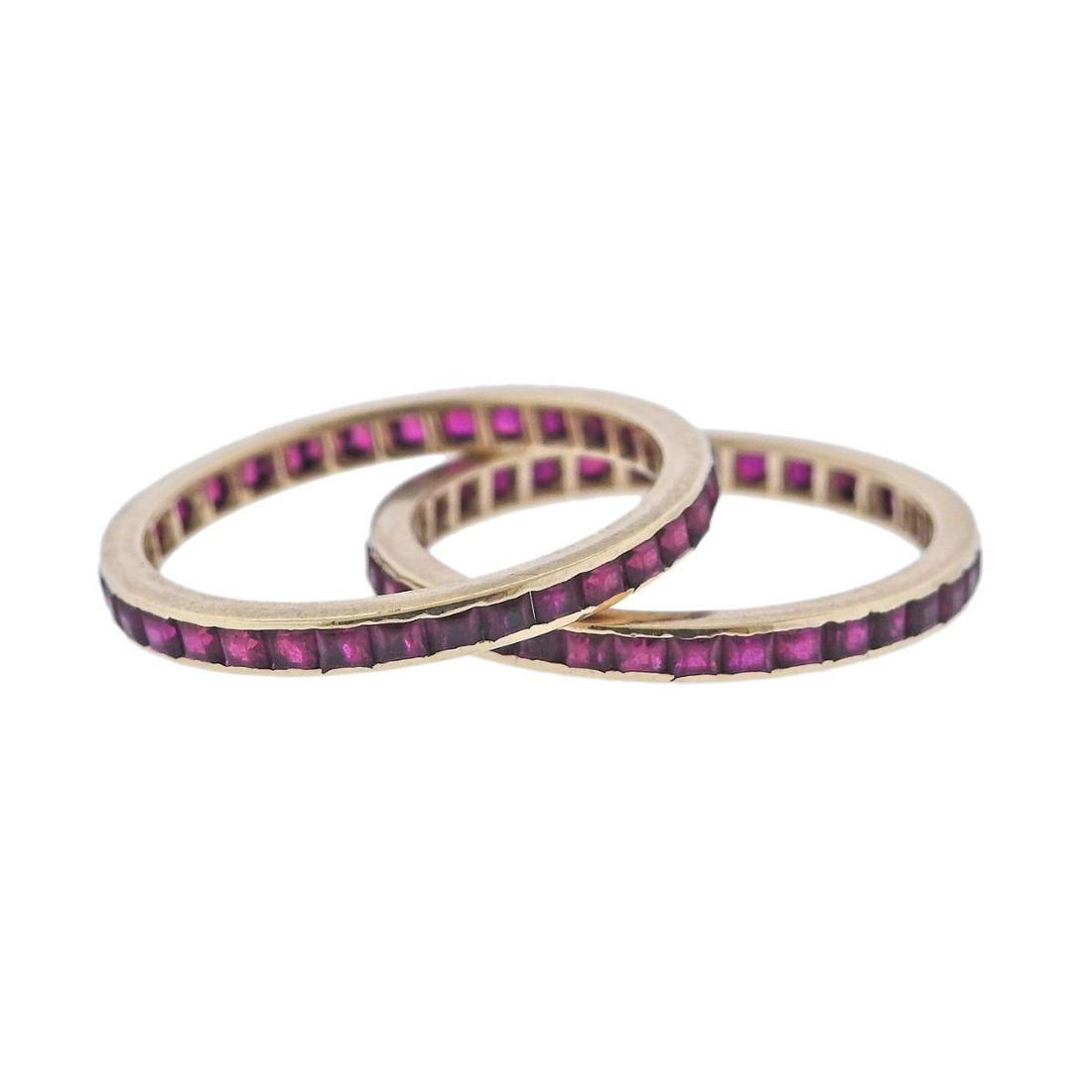 14k Gold Ruby Eternity Wedding Band Ring Set of 2: Metal : 14k Gold Designer : Not Signed Gemstone : Rubies (multiple stones abraded) Measurements : Ring sizes - 10.5 each, width 2.5mm Marked: : tested 14k Weight: 3.9 grams