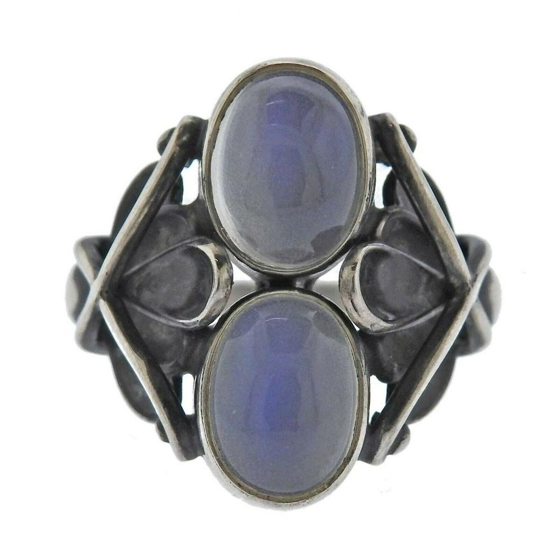 Georg Jensen Moonlight Blossom Moonstone Silver Ring 48: Metal : Sterling Silver Designer : Georg Jensen Gemstone : Moonstone Measurements : Ring size 52, top is 21mm wide Marked: : GJ mark, 925 S, 48 Weight: 6.7 grams