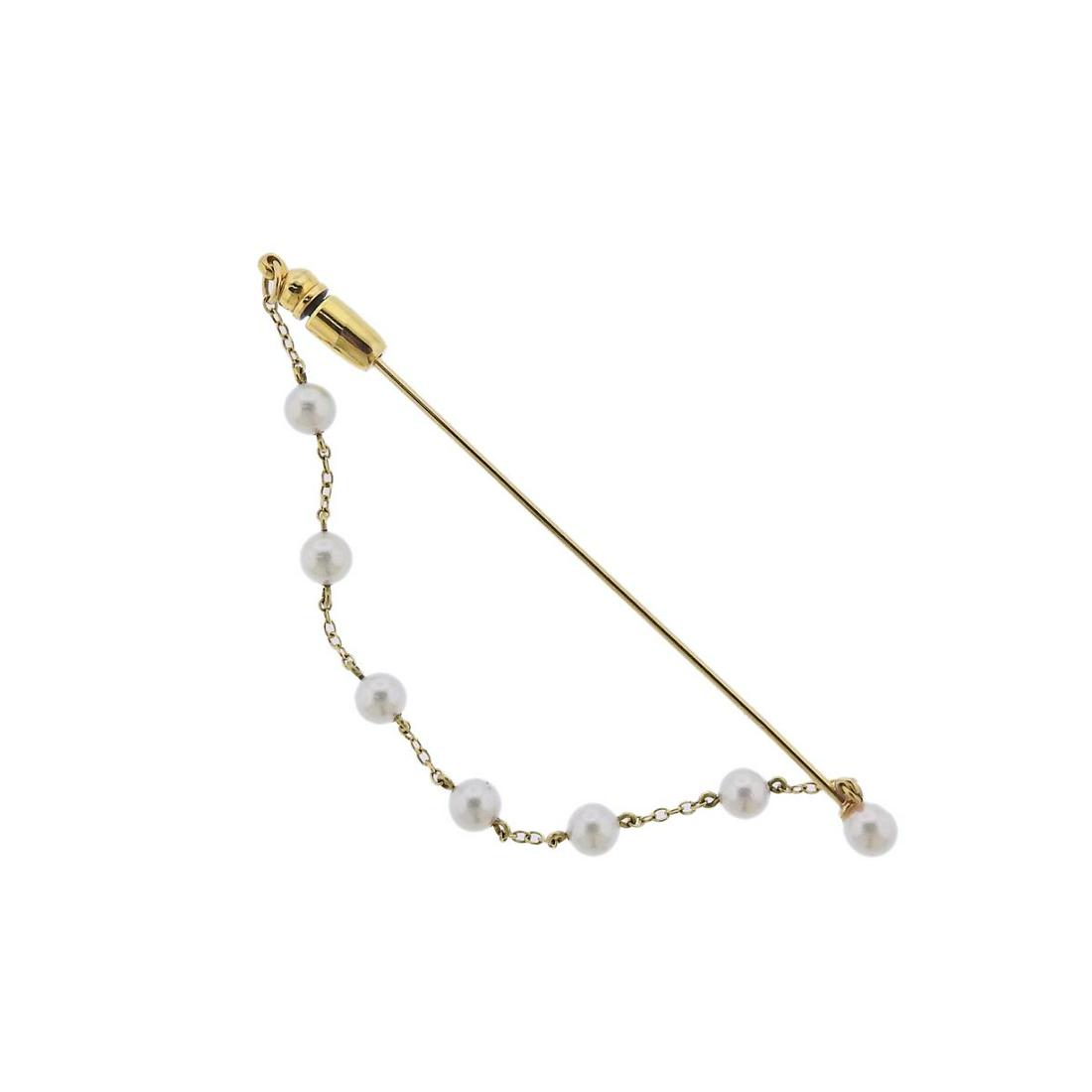 Mikimoto Gold Pearl Brooch Pin: Metal : 18k Gold Designer : Mikimoto Gemstone : Pearl Measurements : Pin is 70mm long, Chain - 4.25" long Marked: : M, 750 Weight: 3 grams