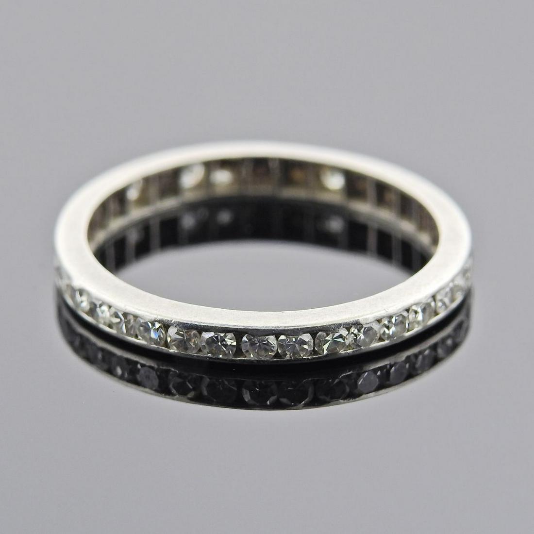 Midcenury Platinum Diamond Eternity Wedding Band Ring: Metal : Platinum Designer : Not Signed Gemstone : Diamonds approx. 0.40ctw Measurements : Ring size 6.25, ring is 2.5mm wide Marked: : tested Plat Weight: 1.9 grams