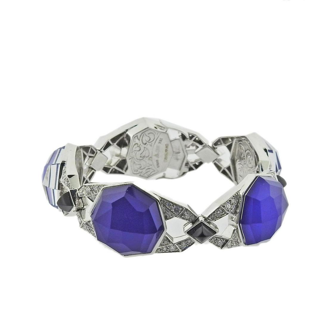 Stephen Webster 18k Gold Lapis Crystal Diamond Onyx Bracelet: Metal : 18k Gold Designer : Stephen Webster Gemstone : Lapis under Crystal, Onyx, Diamonds approx. 1.00ctw Measurements : Bracelet is 6.5" long and 20mm wide Marked: : 18k, SW, English marks