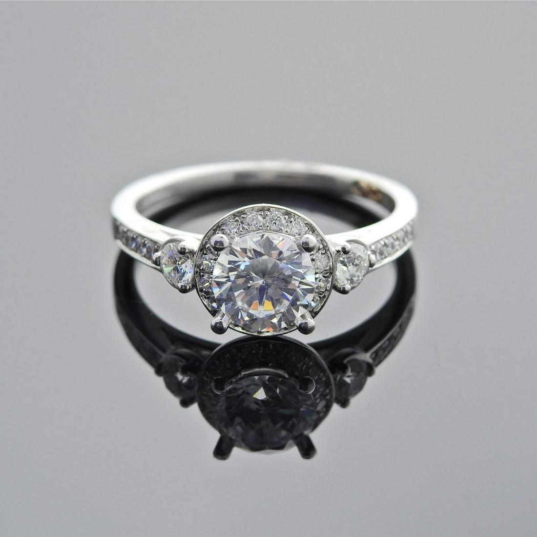 18k Gold Diamond Engagement Ring Setting: Metal : 18k Gold Designer : Designer Signed Gemstone : Center stone is not a diamond - 6.5mm. Side diamonds approx. 0.40ctw Measurements : Ring size 6, ring top is 8.8mm wide Marked: : Maker'