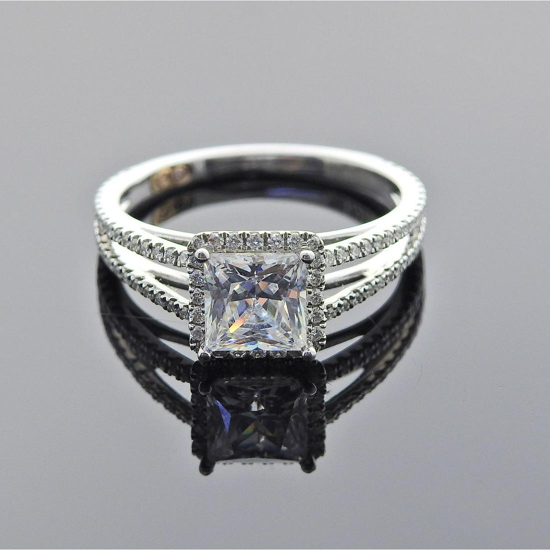 18k Gold Diamond Engagement Ring Setting: Metal : 18k Gold Designer : Designer Signed Gemstone : Center stone is not a diamond - 6mm x 6mm stone. Surrounding diamonds approx. 0.30ctw Measurements : Ring size 6 3/4, ring top is 8mm wide