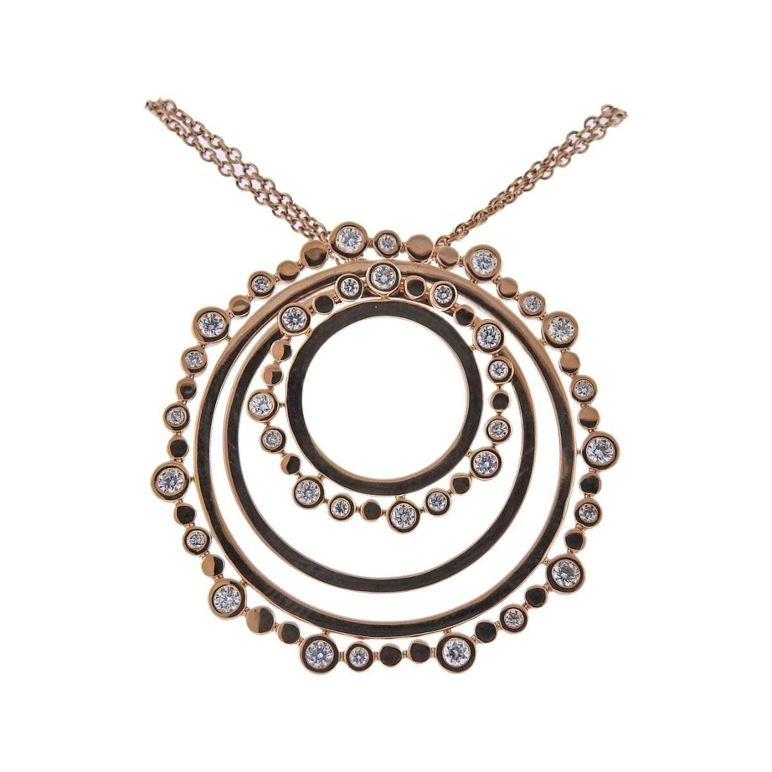Bucherer Gold Diamond Pendant Necklace: Metal : 18k Rose Gold Designer : Bucherer Gemstone : Features 0.69ctw G/Si diamonds. Measurements : Necklace is 29" long, pendant - 38mm in diameter Marked: : CB, 750 Weight : 15.