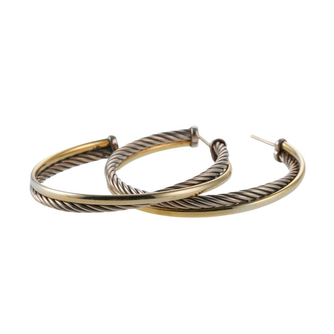 David Yurman Sterling Silver Gold Hoop Earrings: Metal : Sterling Silver and 18k Gold Designer : David Yurman Gemstone : n/a Measurements : Earrings are 46mm x 4.9mm (missing backs) Marked: : David Yurman 925, 750 Weight: 12.6 gra