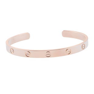 Cartier Love 18k Rose Gold Cuff Bracelet Size 19: Metal : 18k Gold Designer : Cartier Gemstone : None Measurements : Bracelet is Cartier size 19. Retail $5300. Comes with a service receipt copy. Marked: : 19, Cartier, 750, ASX***. <