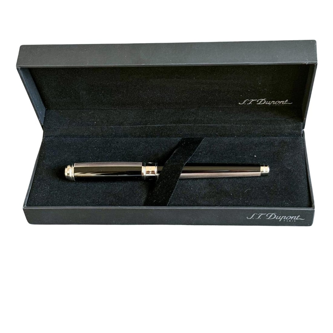 S. T. Dupont Windsor Black Ballpoint Pen: Metal : Palladium Finish Designer : S. T. Dupont Measurements : Pen is 140mm x 12mm. Condition : Mint/unused. Additional : Comes with box, refill and papers.