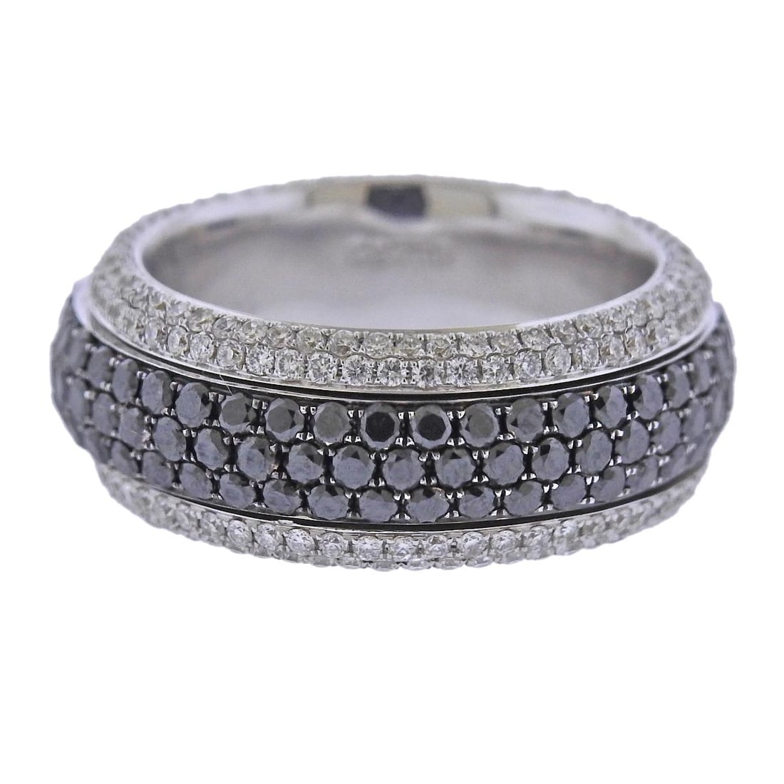 Bucherer Gold Black Diamond Rotating Band Ring: Metal : 18k White Gold Designer : Bucherer Gemstone : White diamonds 1.19ctw, Black diamonds 2.56ctw. Measurements : Ring size 7, width 8.7mm. Center section with black diamonds is rotating.