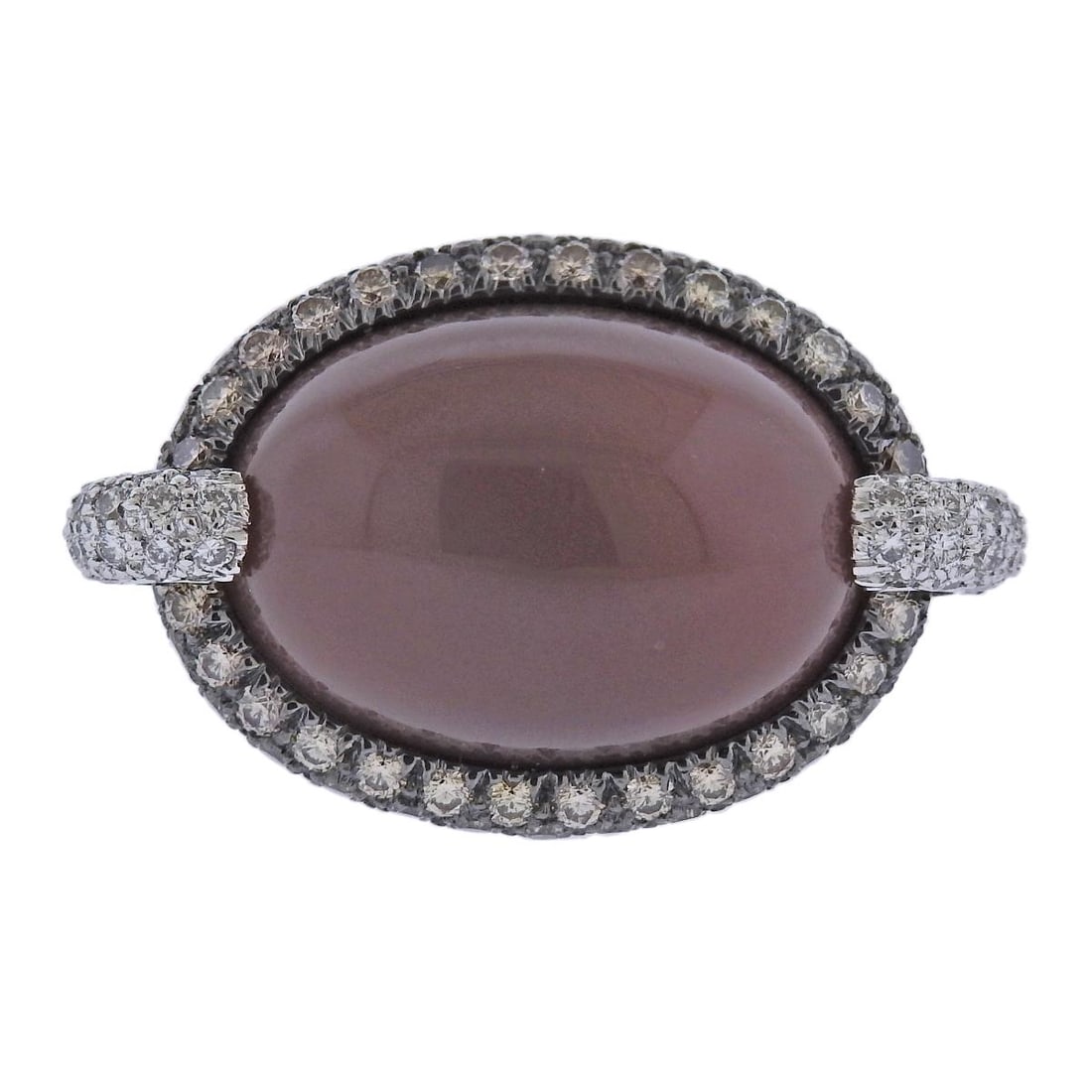 Bucherer Gold Diamond Moonstone Cocktail Ring: Metal : 18k White Gold Designer : Bucherer Gemstone : Moonstone 18.67ct, DIamonds 0.34ctw, Fancy diamonds 1.32ctw. Measurements : Ring size 6.5, top is 18 x 31mm. Marked: : CB 750.