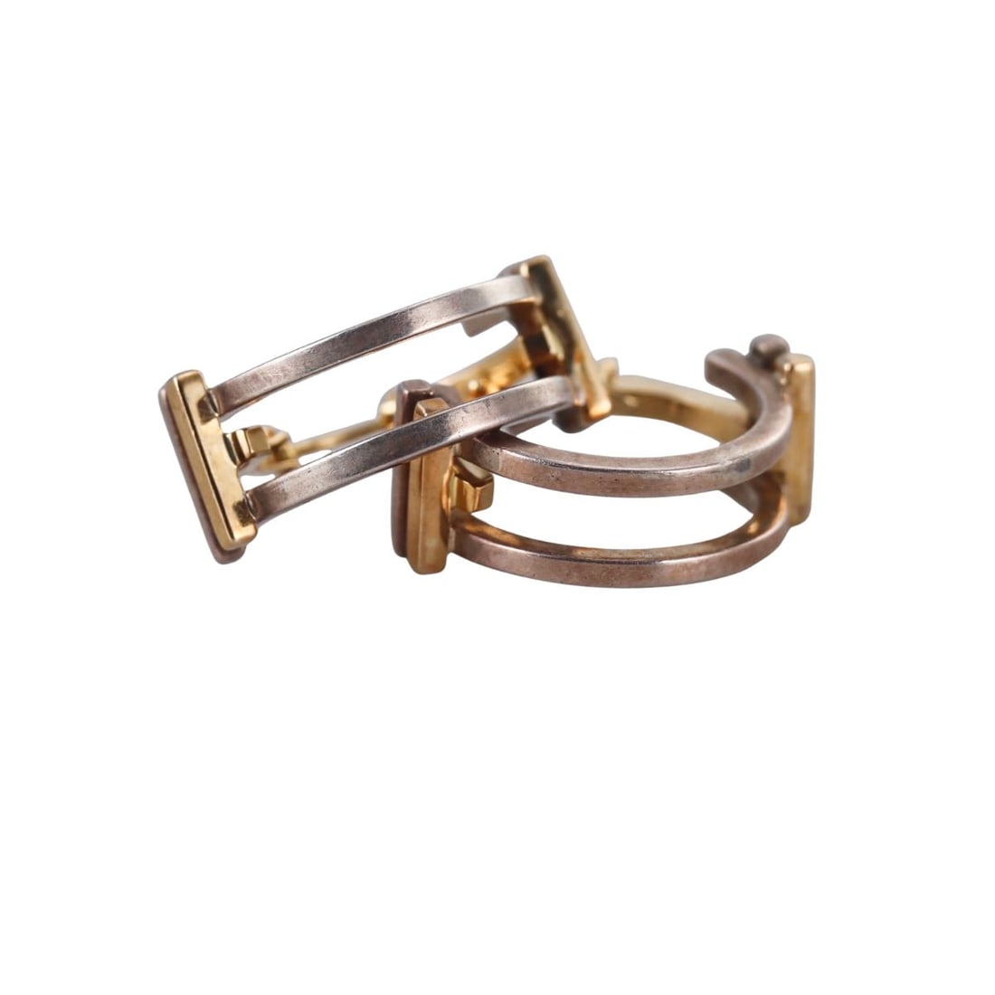TIffany & Co Gehry Axis Silver 18k Gold Hoop Earrings: Metal : 18k Gold / Sterling Silver Designer : Tiffany & Co Gehry Gemstone : None Measurements : Earrings are 25mm in diameter x 8mm wide. Marked: : Tiffany & Co, Gehry, 925. Weight