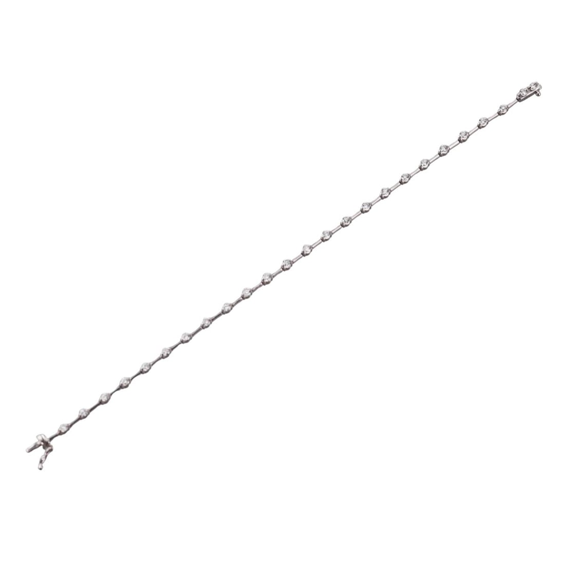 Line 1.25ctw Diamond Station Gold Bracelet: Metal : 18k Gold Designer : Line Gemstone : Diamonds 1.25ctw Measurements : Bracelet is 7 1/4" long x 2.3mm at widest point Marked: : Line 1.25 18k WG Weight: : 7.5 grams <