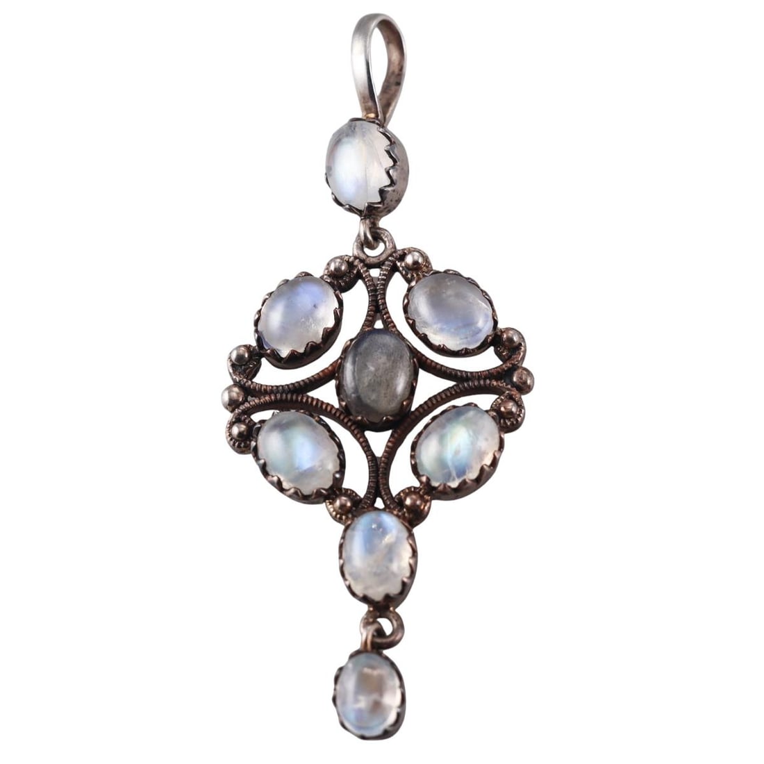 Antique Silver Moonstone Pendant: Metal : Silver Designer : Not Signed Gemstone : Moonstone cabochon Measurements : Pendant is 75mm x 31mm Marked: : Silver punch mark Weight: : 11.6 grams Condition