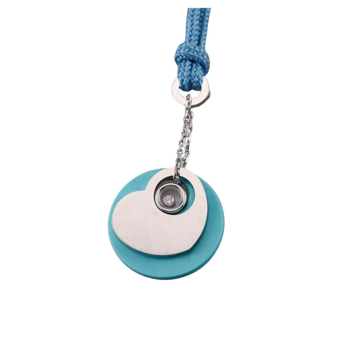 Chopard Happy Diamonds Turquoise 18k Gold Diamond Pendant on Cord Silver Necklace: Metal : 18k White Gold / Sterling Silver / Cord Designer : Chopard Gemstone : Turquoise, Diamond Measurements : Pendant is 25mm in diameter, Cord is 16". Marked: : Chopard,