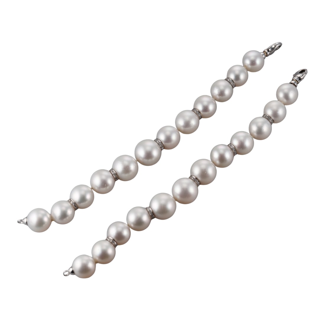 18k Gold South Sea Pearl Diamond Bracelet Set: Metal : 18k White Gold Designer : Not Signed Gemstone : South Sea pearls - 14.2mm to 16.3mm, Diamonds approx. 0.80ctw. Measurements : Bracelets are 8 1/8" long each . Marked: : 18k. <