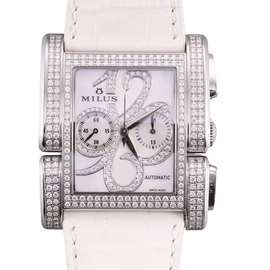 Milus Chronograph Diamond Steel Ladies Watch APIC014: Metal : Stainless Steel Designer : Milus Movement : Automatic - working order. Measurements : Case 38mm x 45mm. Original band with buckle - 7.75" long. Reference/Model: : ETA 2094/Milus 1