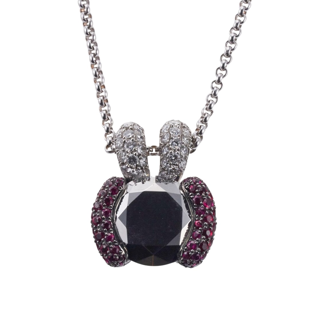 Chopard Ruby Hematite 18k Gold Pendant Necklace: Metal : 18k White Gold Designer : Chopard Gemstone : Diamonds 0.84ctw, Rubies 2.53ctw, Hematite 14mm. Measurements : Necklace is 16" long, pendant is 25mm x 20mm. Marked: : Chopard, 7