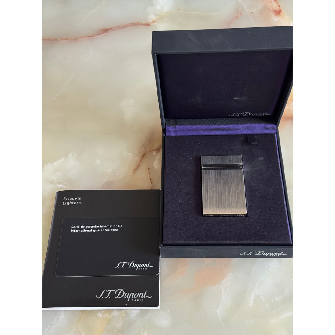 S.T. Dupont Coupe Cigare Brosse Palladium Finish Lighter 003242: Material : Palladium Finish Designer : S.T. Dupont Measurements : 62mm x 38mm x 11mm. Marked: : S.T.Dupont, Paris, made in France, 1EGBT92. Condition: : New, in box. Addition