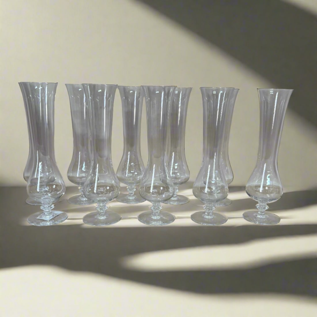 Baccarat Crystal Cosmos Champagne Glass Set of 10: Material : Crystal Designer : Baccarat Measurements : H: 7 7/8'' D: 1 5/8'' Marked: : Baccarat. Condition: : New, store sample. Additional: No box.