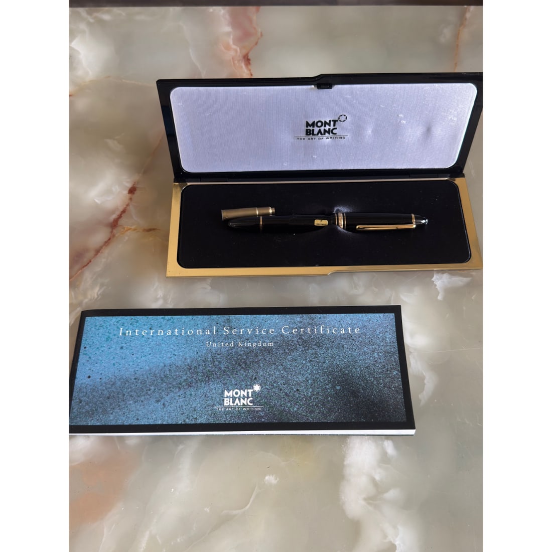 Montblanc Gold-Coated Black Lacquer 14k Gold F Nib Fountain Pen: Material : Gold-Coated /14k Gold Nib Designer : Montblanc Measurements : Length 140mm. Condition: : New, old stock . Additional: With box and booklet.