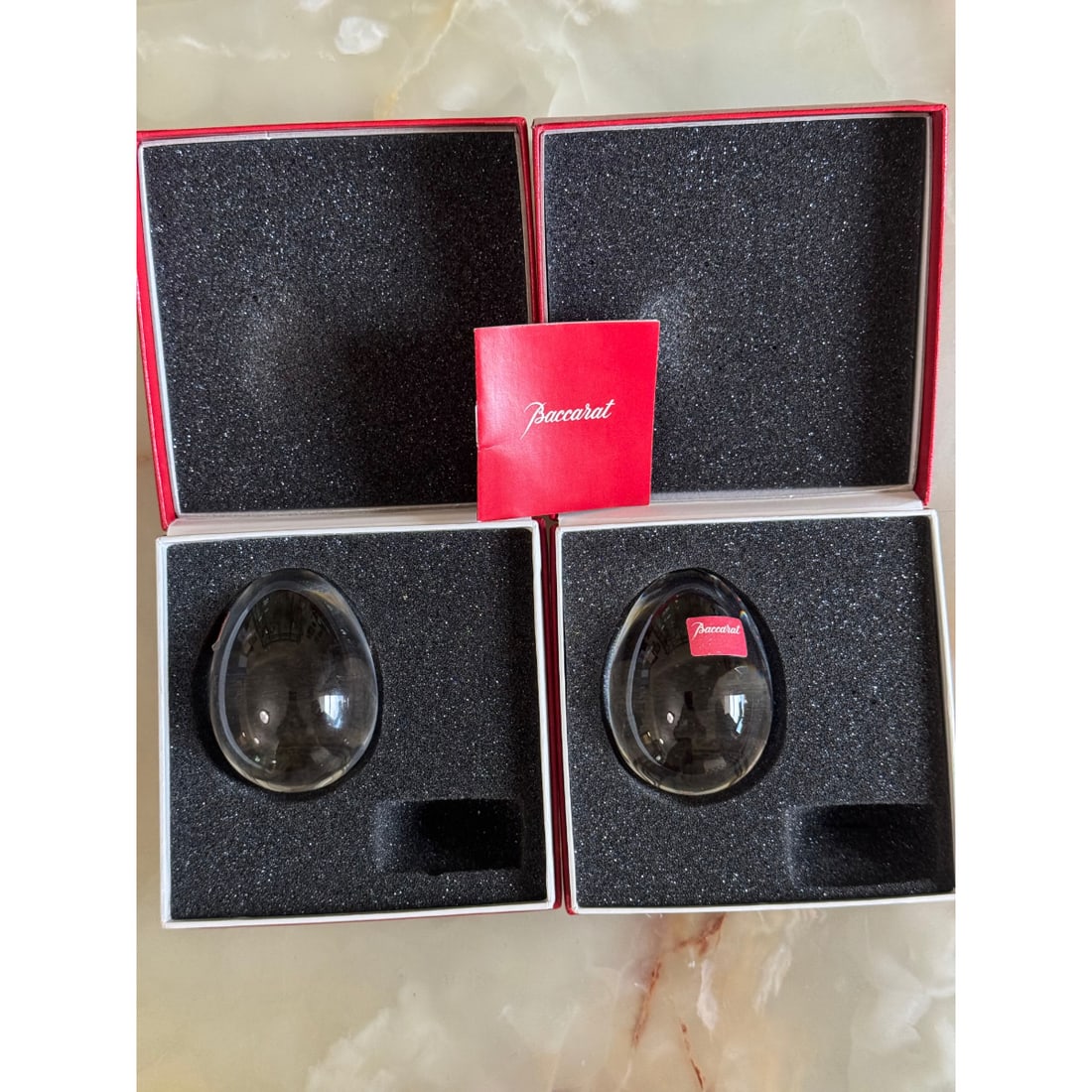 Baccarat Egg Figurine Set of 2 #2103692: Material : Crystal Designer : Baccarat Measurements : 2.25" x 1 5/8". Marked: : Baccarat. Condition: : New, old stock. Without stands. Additional: In boxes. No stands.