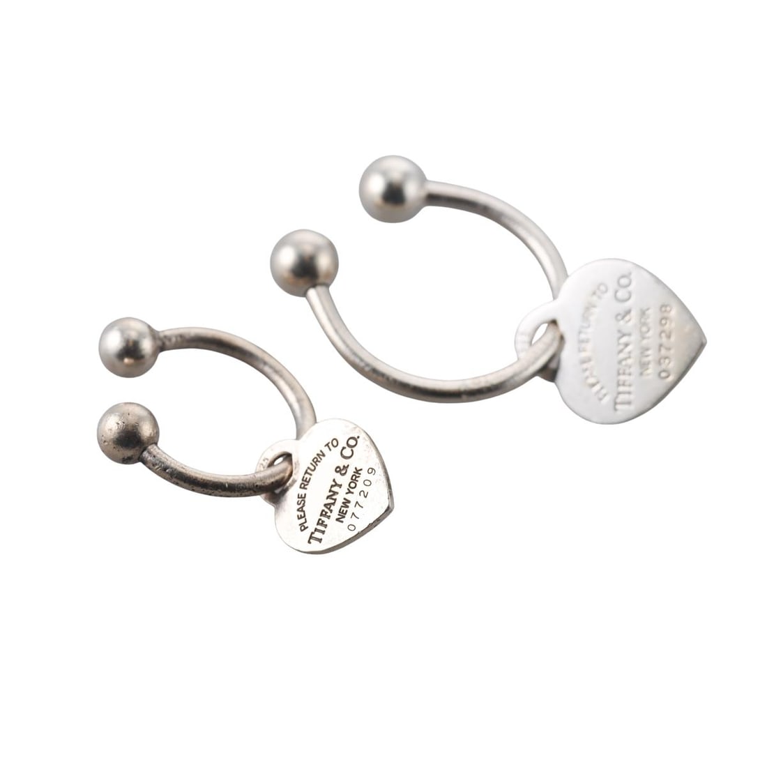 Tiffany & Co Sterling Silver Heart Horseshoe Key Ring Set of 2: Metal : Sterling Silver Designer : Tiffany & Co Gemstone : None Measurements : The biggest ring is 40mm in diameter, the smallest ring is 30mm in diameter Marked: : 2001 Tiffany & Co 925