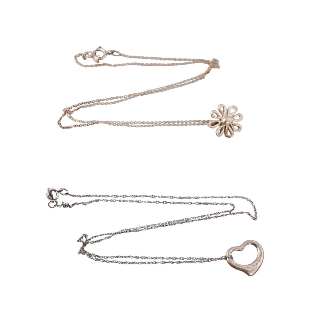 Tiffany & Co Sterling Silver Heart Daisy Pendant Necklace Lot of 2: Metal : Sterling Silver Designer : Tiffany & Co Gemstone : None Measurements : Necklaces are 17' and 18". Pendants are 13.5mm and 15.5mm Marked: : T & Co, 925, Paloma Picasso, Elsa Perett