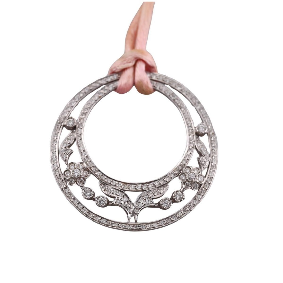 Leslie Greene 18k Gold Diamond Cord Pendant Necklace: Metal : 18k White Gold/ Silk Cord Designer : Leslie Greene Gemstone : Diamonds approx. 0.70ctw H/VS Measurements : Necklace is 15.5" long, pendant is 41mm in diameter Marked: : NZ 18k
