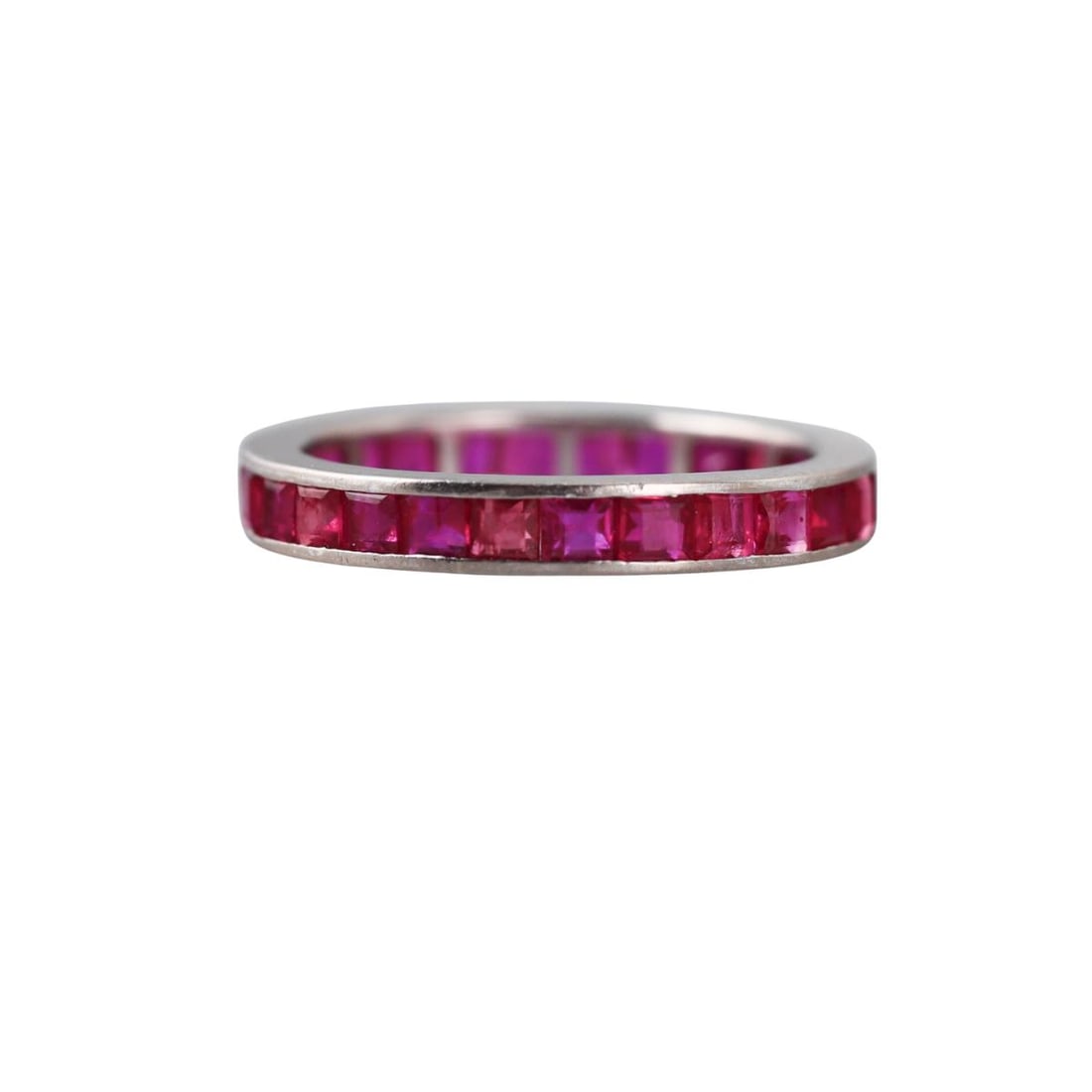 18k Gold Ruby Eternity Band Ring: Metal : 18k White Gold Designer : Not Signed Gemstone : Rubies (several stones have small chips/abrasions) Measurements : Ring size 7, width 3.3mm. Marked: : 750. Weight:
