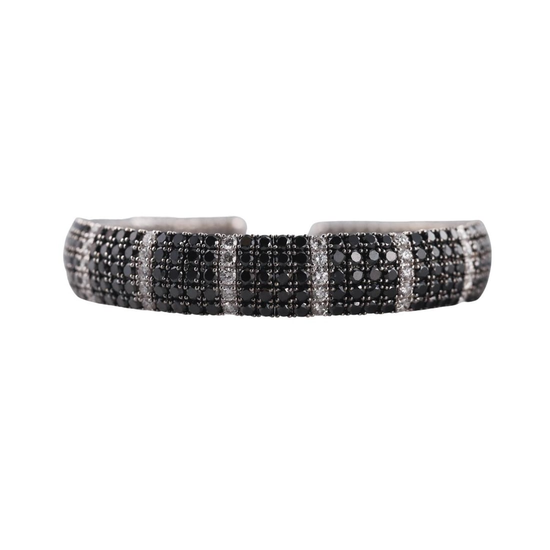 18K Gold 7.83ctw Black White Diamond Cuff Bracelet: Metal : 18K White Gold Designer : Not Signed Gemstone : Black and White Diamonds- 7.83ctw Measurements : Bracelet will fit up to 6" wrist Marked: : K18, JT, 7.83 Weight: :