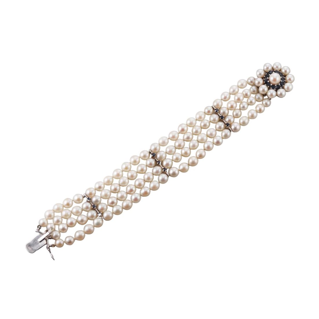Mid Century 14K Gold Pearl Sapphire Bracelet: Metal : 14K White Gold Designer : Not Signed Gemstone : Sapphires, Pearls 5-6.8mm Measurements : Bracelet is 7" long and 23mm wide Marked: : 14K Weight: : 39.3 grams