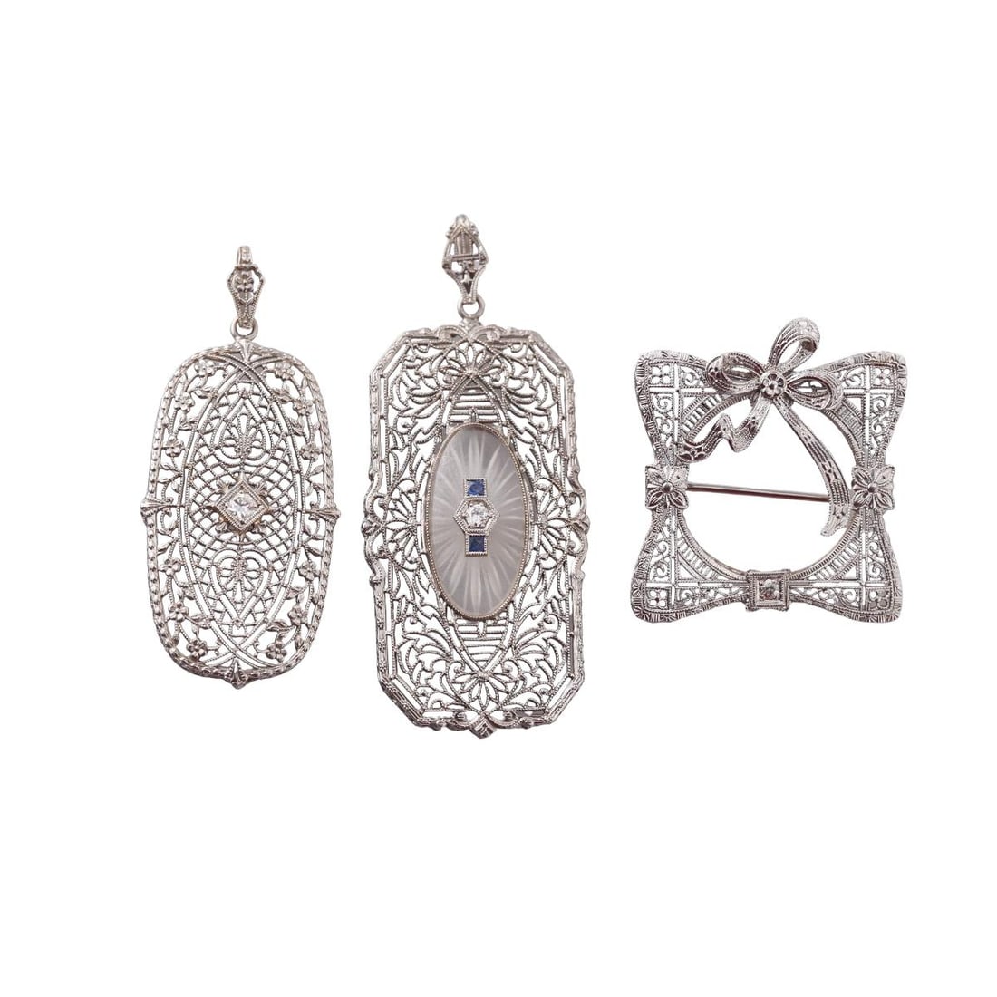 Art Deco Filigree 14k Gold Diamond Pendant Brooch Lot of 3: Metal : 14k White Gold Designer : Not Signed Gemstone : Diamonds approx. 0.10ctw, Sapphire, Frosted crystal Measurements : Pendants are 45mm and 54mm long. Brooch - 28 x 28mm. Marked: