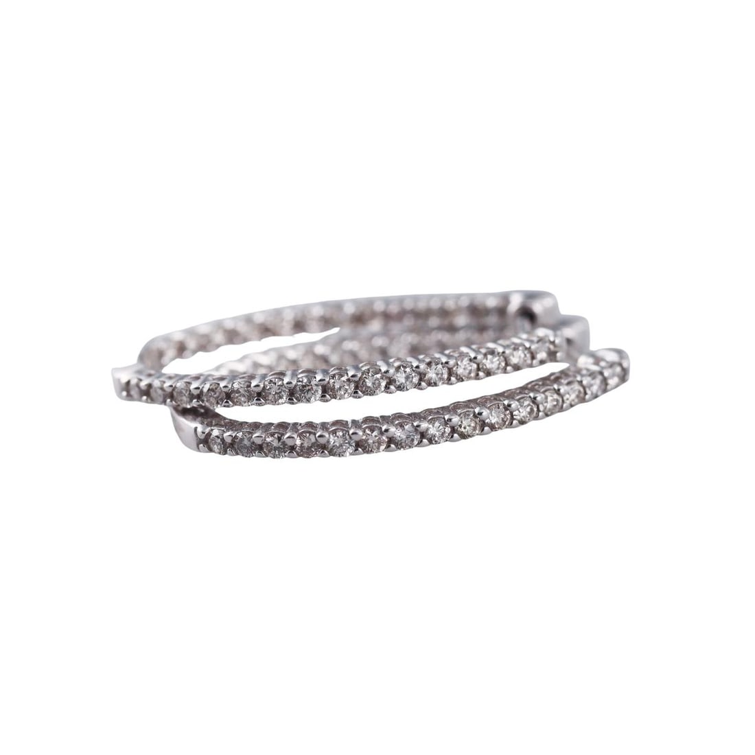 14k Gold Diamond Inside Out Oval Hoop Earrings: Metal : 14k White Gold Designer : Not Signed Gemstone : Diamonds approx. 0.54ctw. Measurements : Earrings are 28mm x 18mm. Marked: : 14k. Weight: : 4.3 grams