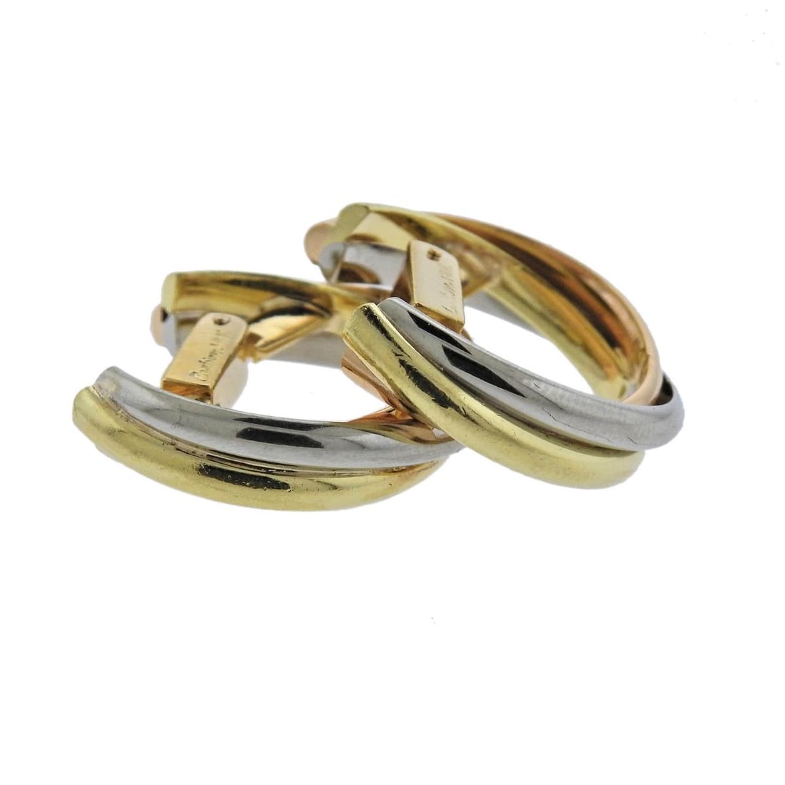 Vintage Cartier Trinity 18K Gold Cufflinks: Metal : 18K White, Yellow and Rose Gold Designer : Cartier Gemstone : None Measurements : Cufflink top is 26mm at widest point Marked: : Cartier, 750 Weight: : 19.7 gram