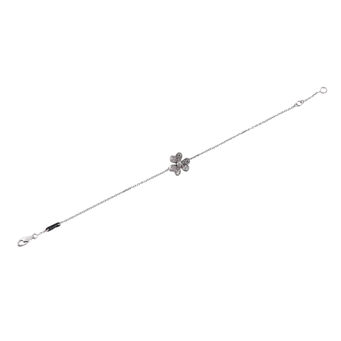 Van Cleef & Arpels Frivole 18K Gold Diamond Bracelet: Metal : 18K White gold Designer : Van Cleef & Arpels Gemstone : Diamonds-approx. 0.21ctw (FG/VVS) Measurements : Bracelet is 6.25" to 6.75" long, flower is 11mm x 11mm Marked: : VCA, Au75