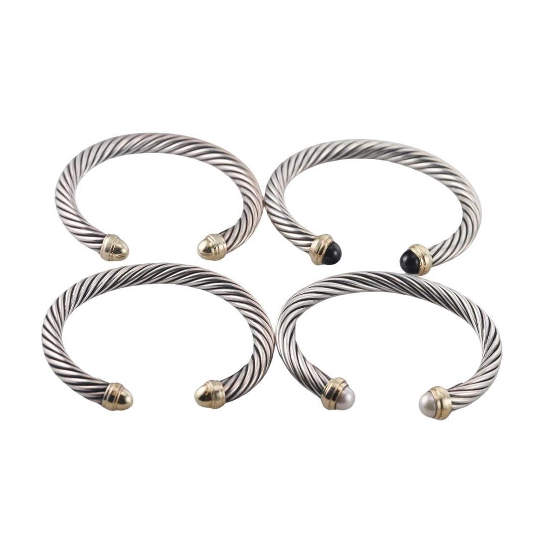 David Yurman Cable 14K Gold Sterling Onyx Pearl Cuff Bracelet Lot of 4: Metal : 14K Yellow Gold, Sterling Silver Designer : David Yurman Gemstone : Pearls 8mm , Onyx Measurements : Bracelets will fit 7" and 6.5" wrist. Bracelet width is 7.5mm Marked: : D.Y