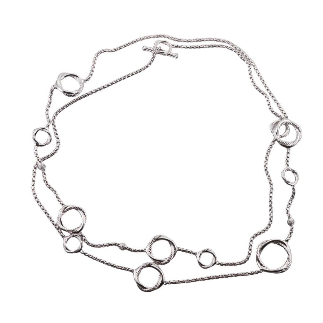 David Yurman Infinity Sterling Silver Diamond Long Toggle Necklace: Metal : Sterling Silver Designer : David Yurman Gemstone : Diamonds Measurements : Necklace is 43" long. Biggest circle is 25mm. Marked: : D.Y. 925 Weight: : 66.5 gram