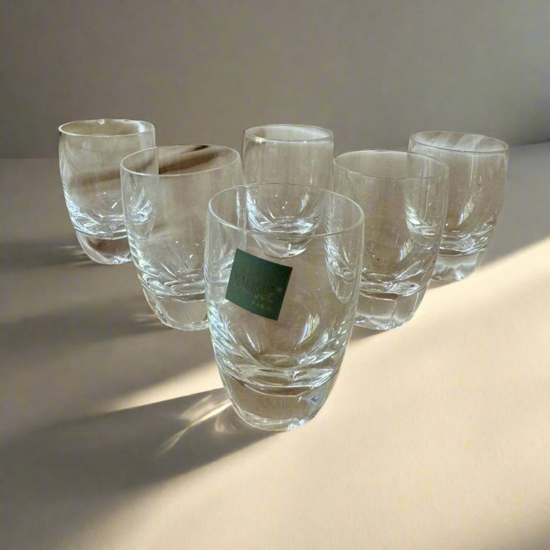 Set of 6 Lalique Highlands Crystal Flat Liquor Tumbler 13413: Material : Crystal Designer : Lalique Measurements : H 2 3/4", D: 1 7/8'' Marked: : Lalique Condition: : New/Store Sample Additional: Box
