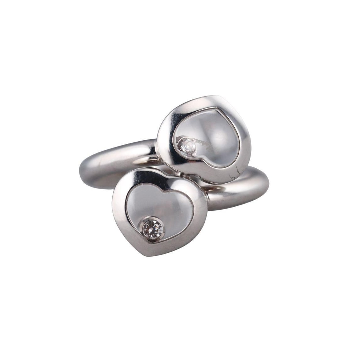 Chopard Happy Diamonds 18k Gold Heart Bypass Ring 829393: Metal : 18k White Gold Designer : Chopard Gemstone : Diamonds approx. 0.06ctw. Measurements : Ring size 5.75, top is 20mm wide. Marked: : Chopard, Au750, 829393, Serial No.