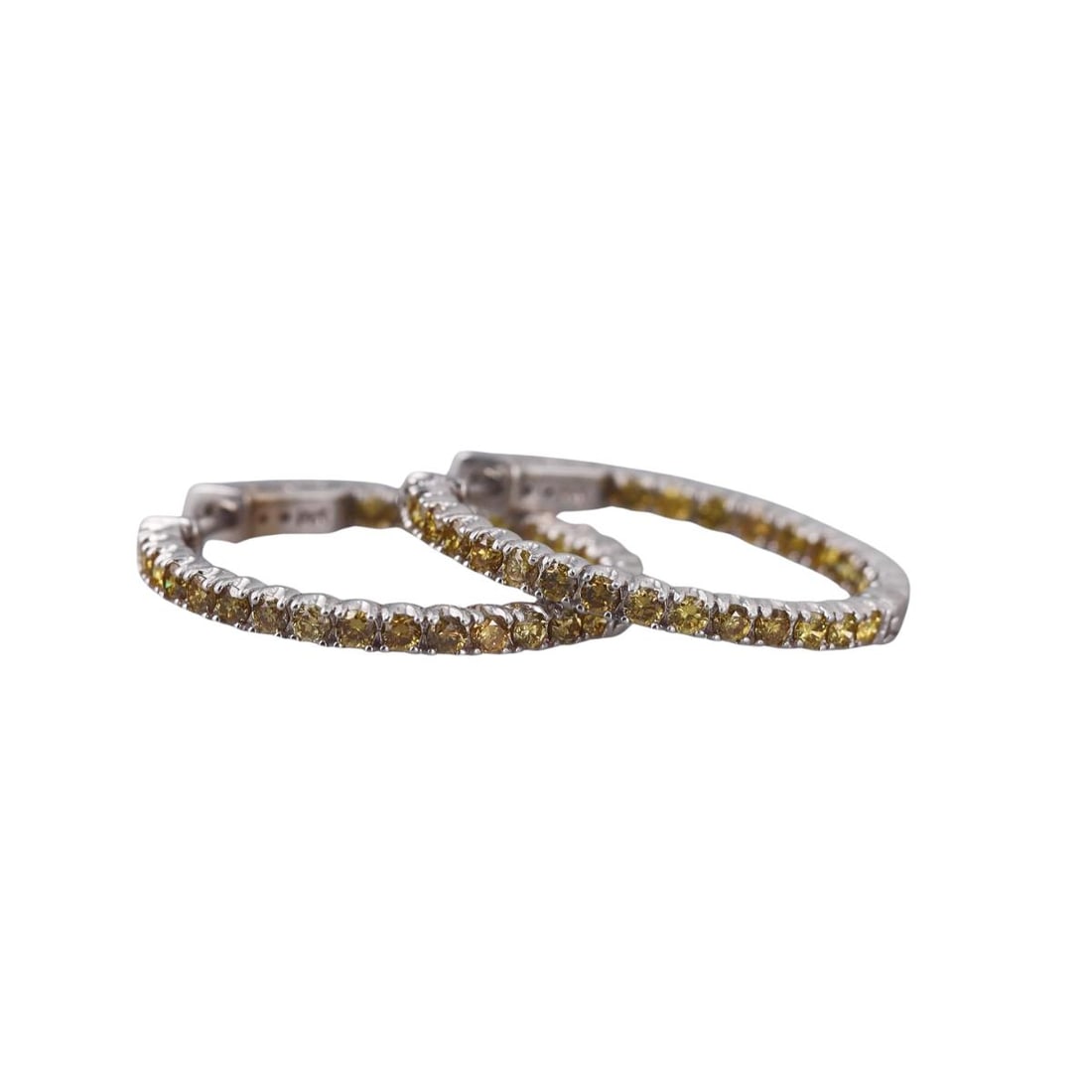 14k Gold Fancy Yellow Diamond Inside Out Hoop Earrings: Metal : 14k White Gold Designer : Not Signed Gemstone : Fancy yellow diamonds approx. 1.50ctw. Measurements : Earrings are 28mm in diameter. Marked: : 14k. Weight: : 7