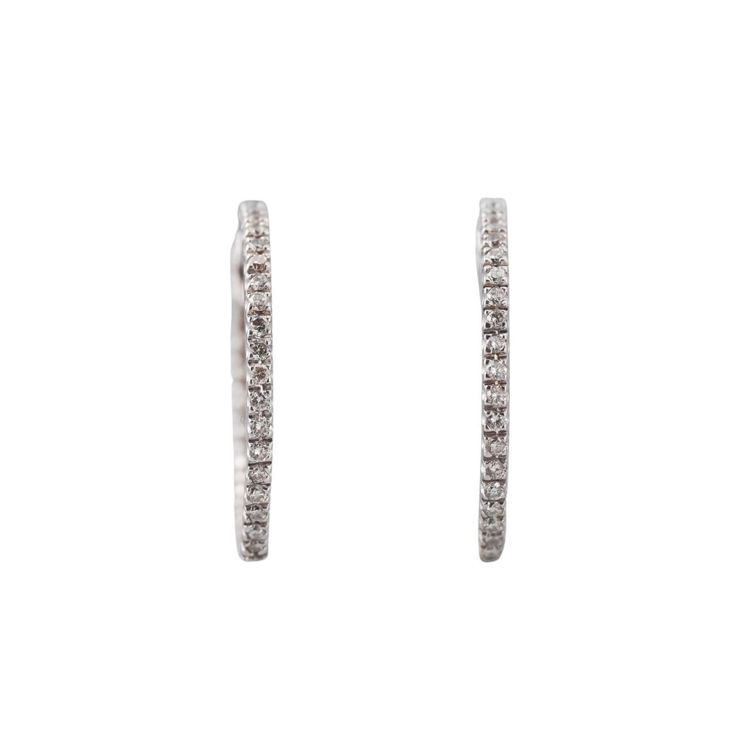 18k Gold Diamond Inside Out Hoop Earrings: Metal : 18k White Gold Designer : Not Signed Gemstone : Diamonds approx. 0.46ctw. Measurements : Earrings are 25mm in diameter x 1.8mm wide. Marked: : 18k. Weight: : 4
