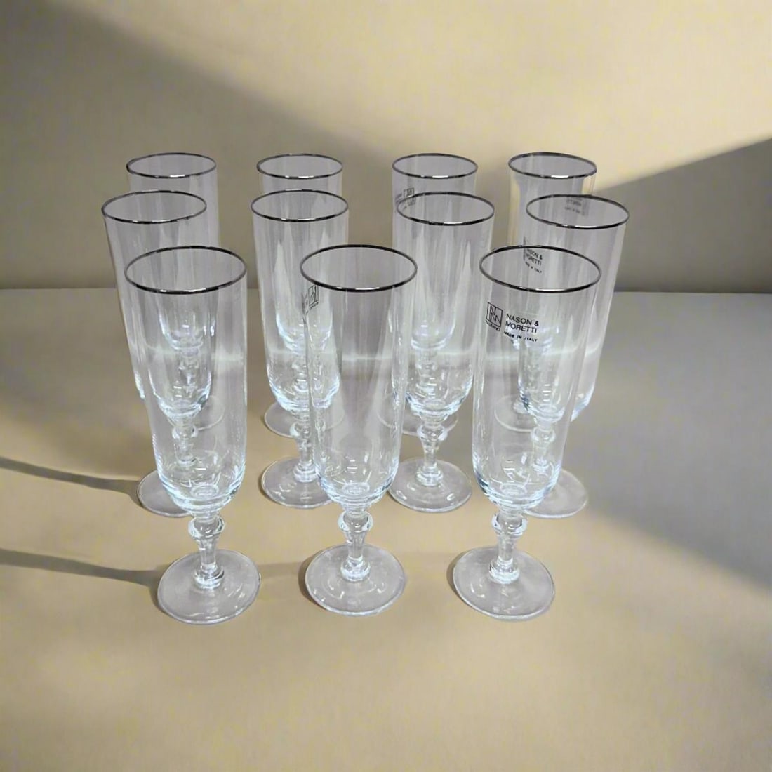 Set of 11 Nason & Moretti Murano Gold Clear Champagne Flutes Glass: Material :Murano glass Designer : Carlo Moretti Measurements : 7.6" (H) x 2.15" (top Diam.) / 19.5cm (H) x 5.5cm (top Diam.) Marked: : Carlo Moretti Condition: : New, store sample