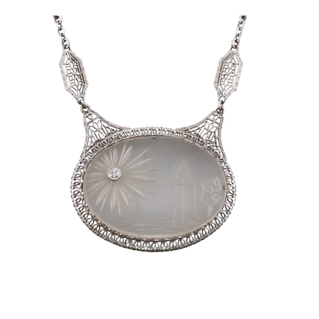 Art Deco Filigree 14k Gold Carved Crystal Diamond Pendant Necklace: Metal : 14k White Gold Designer : Not Signed Gemstone : Crystal, Diamond. Measurements : Necklace is 16" long, pendant is 35mm x 26mm. Marked: : 14k. Weight: : 7.5 gra