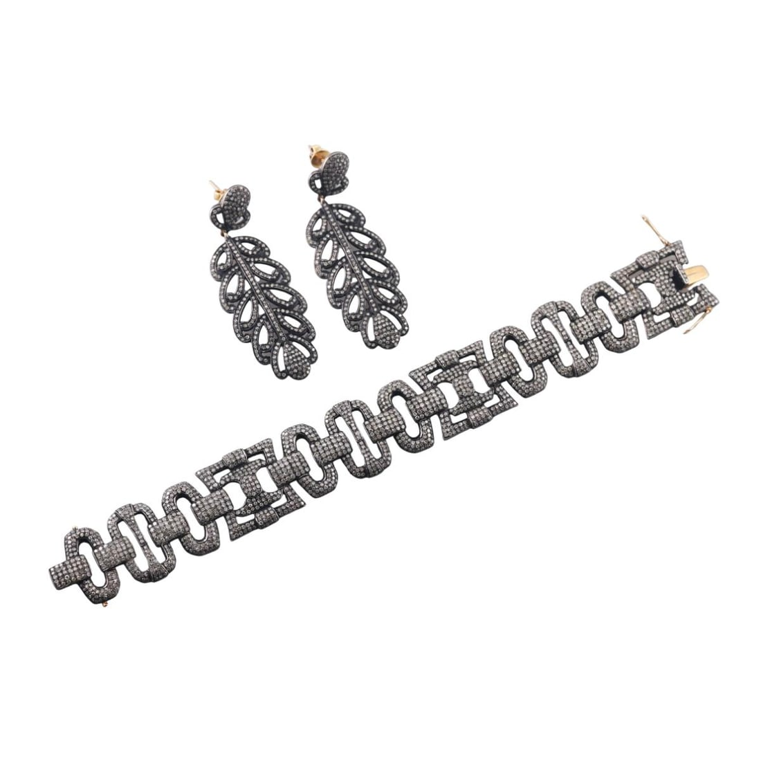 14k Gold Sliver 5ctw Diamond Bracelet Feather Earrings Lot: Metal : 14k Gold / Sterling Silver Designer : Not Signed Gemstone : Diamonds approx. 5.00ctw. Measurements : Bracelet is 7.25" long and 23mm wide. Earrings - 60mm x 22mm. Marked: : 14