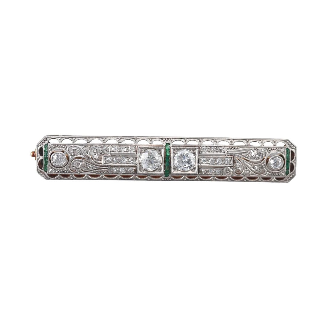 Art Deco Gold Platinum Diamond Emerald Bar Brooch Pin: Metal : 18k Gold / Platinum Designer : Not Signed Gemstone : Two larger OEC diamonds - approx. 1.20ctw HI-SI-I1, Side diamonds 0.50ctw, Emeralds. Measurements : Brooch is 63mm x 10mm. Mar