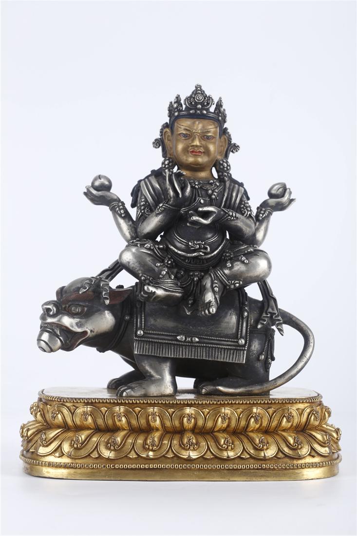 A SILVER VAISRAVANA BUDDHA STATUE.: Silver Vaisravana Buddha Statue.