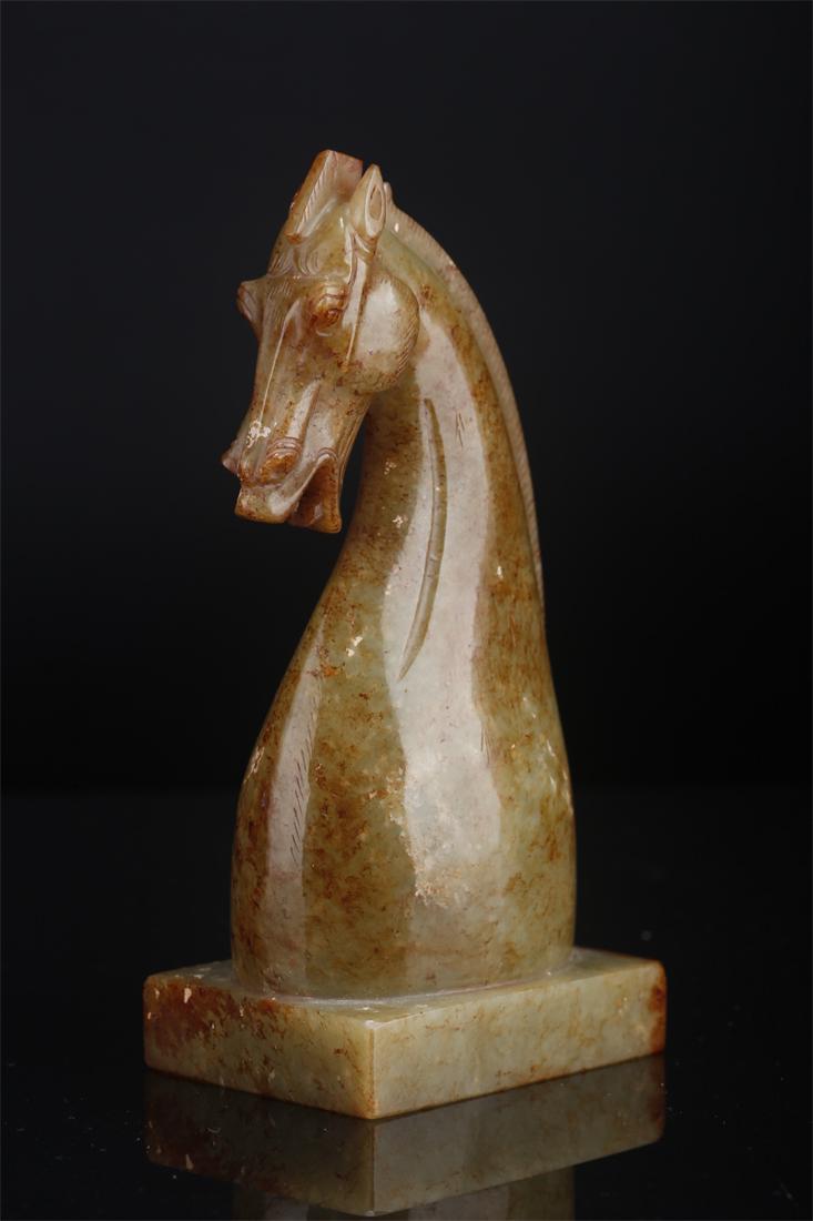 AN ANTIQUE JADE HORSE-KNOB SEAL. (1 of 9)